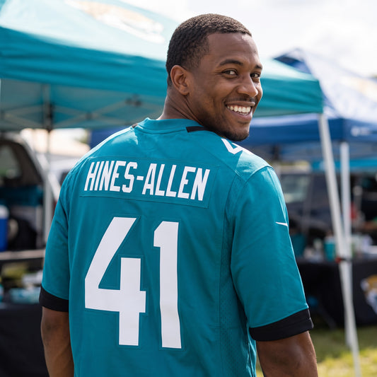 Jacksonville Jaguars Men's Josh Hines-Allen Nike Teal Player Game Jersey - on-model lifestyle photo