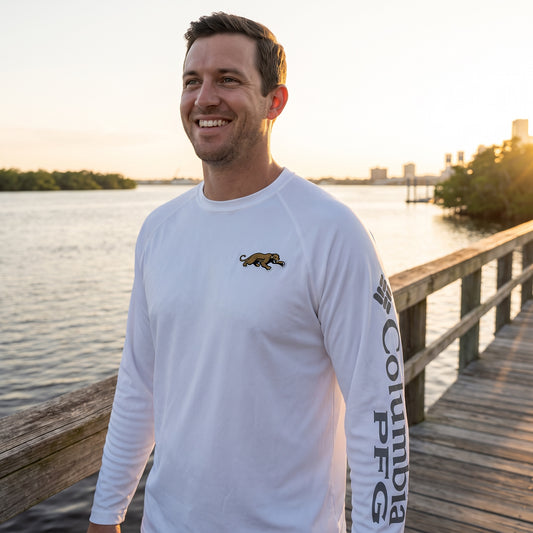 Jaguars Prowler Columbia PFG Terminal Tackle Fish Flag long sleeve worn on a Jacksonville dock