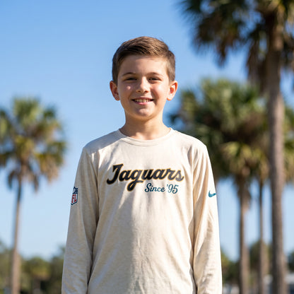 NFL Jacksonville Jaguars Nike Youth Rivalry Dri-FIT Long Sleeve Legend Tee - on-model lifestyle photo