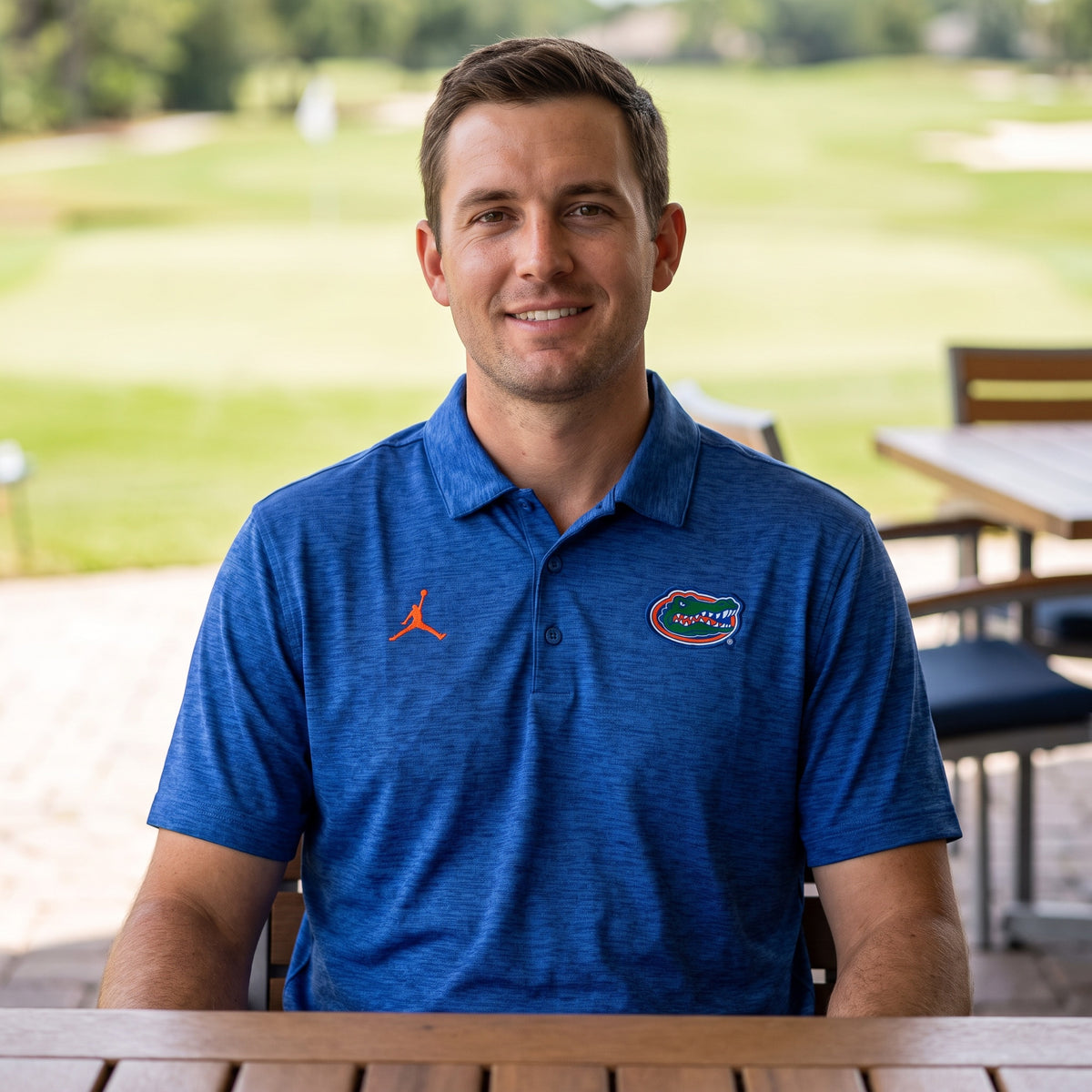 Florida Gators Jordan Heathered Victory Plus polo worn on a golf course