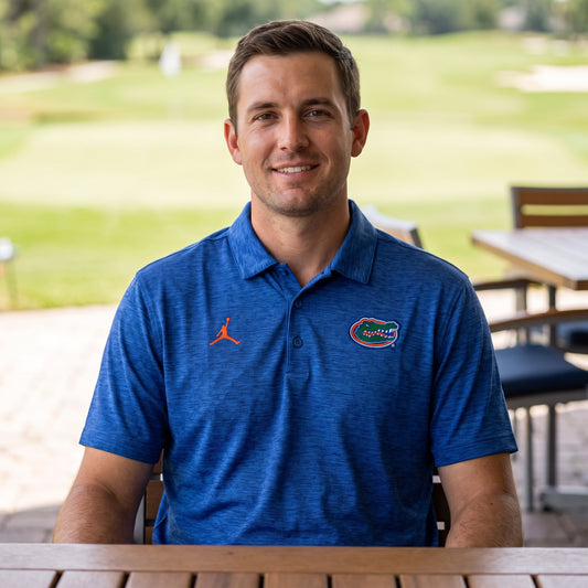Florida Gators Jordan Heathered Victory Plus polo worn on a golf course