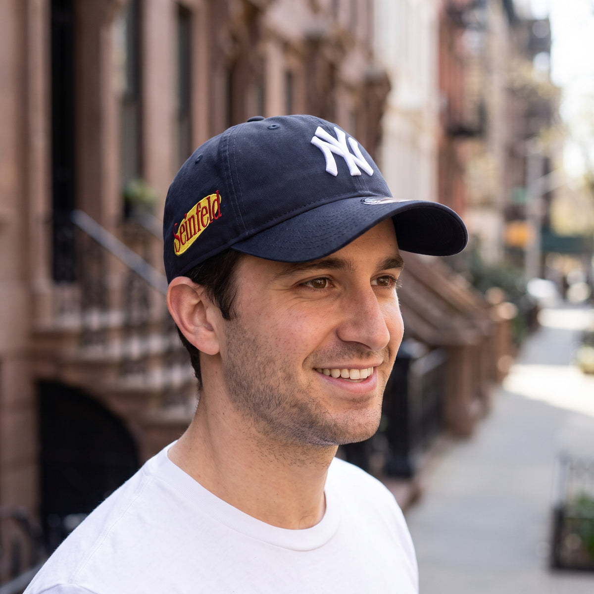New York Yankees New Era Seinfeld 9TWENTY cap worn on a city sidewalk